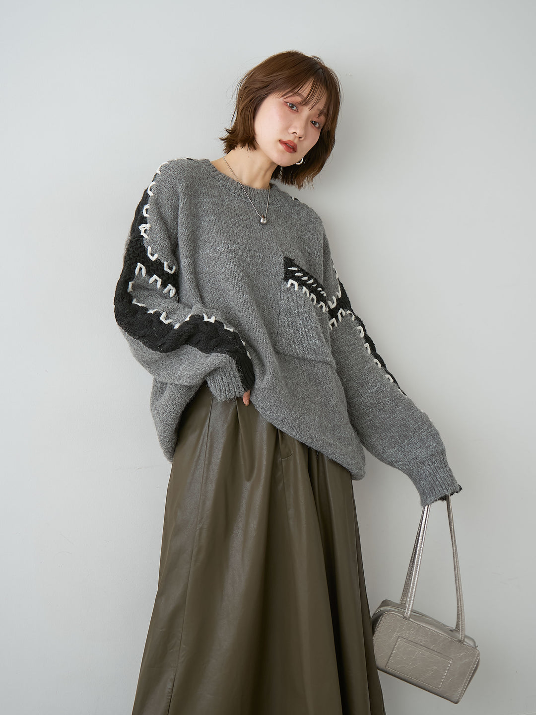 [SET]ハンドステッチデザインニットトップス+レザータッチフレアスカート(2set)
