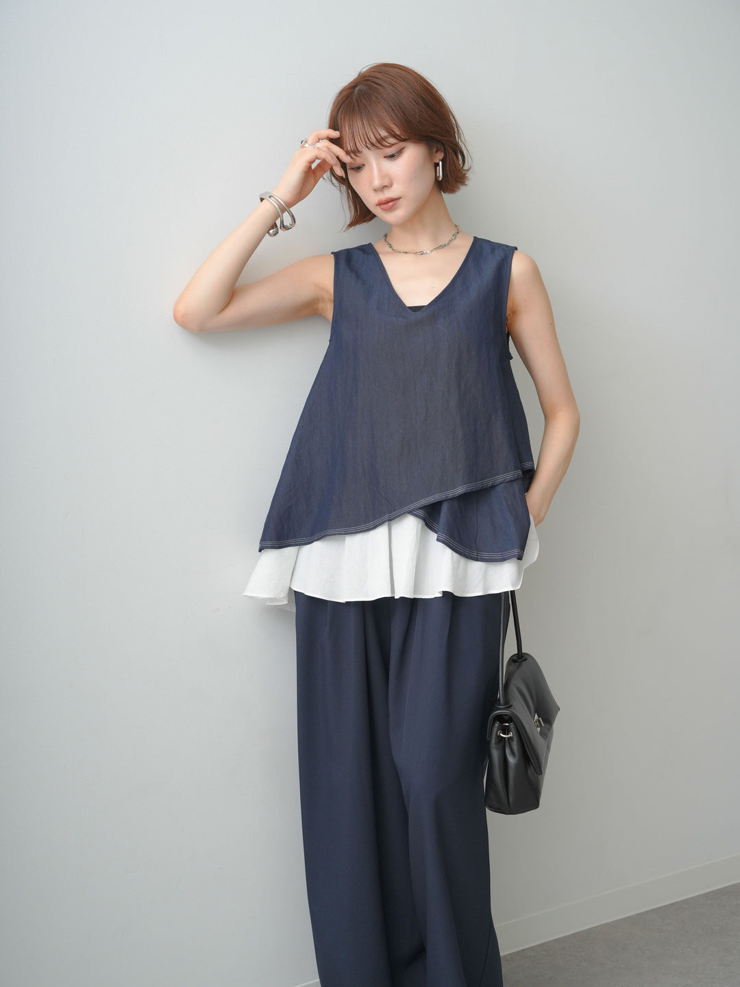 [予約]アシメフリルドッキングステッチノースリブラウス/navy